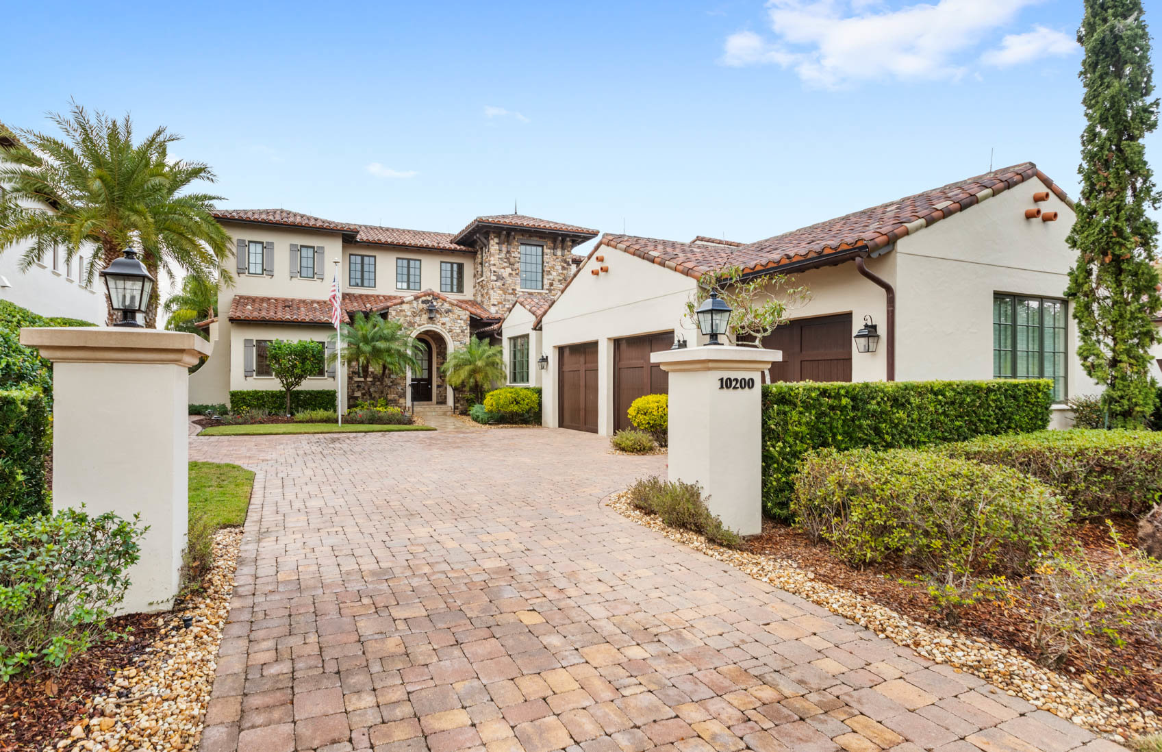 front of two story luxury home in golden oak